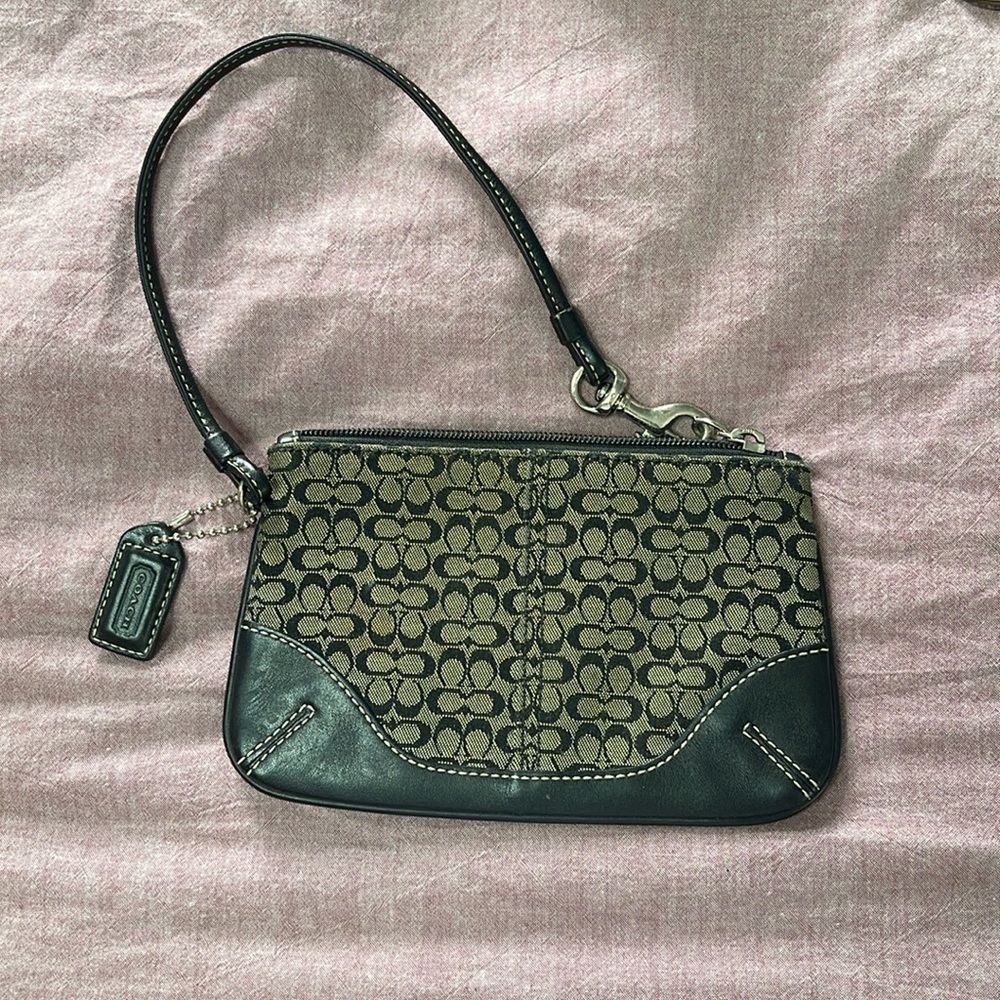Black and grey Coach wristlet